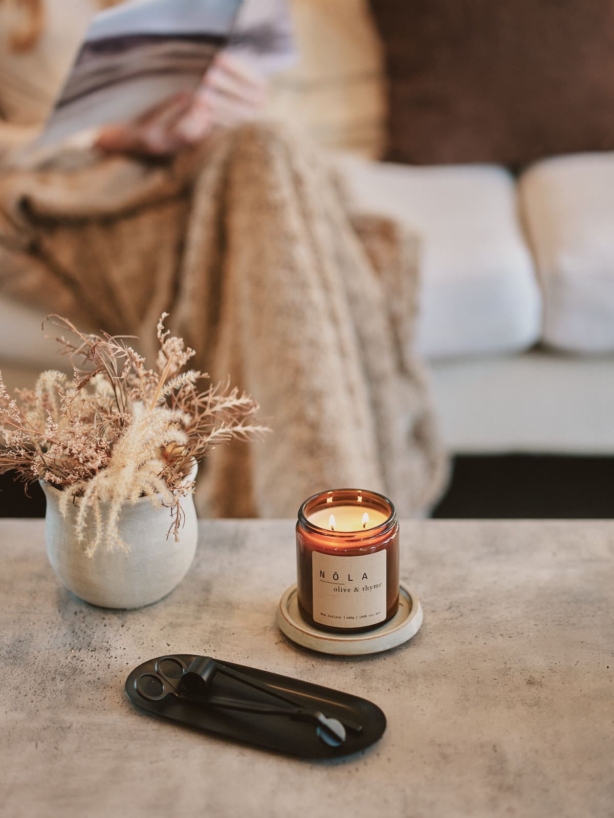NŌLA room spray and reed diffuser in a warm interior